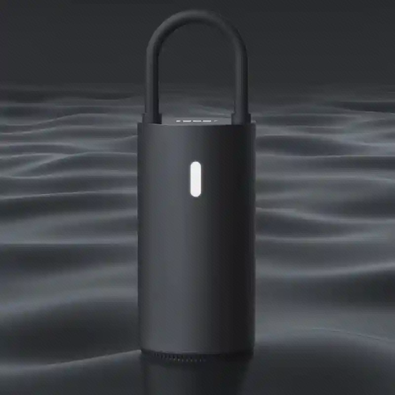 پمپ باد Xiaomi MOJIETU CQB01MC با چراغ روشن در فضای تیره