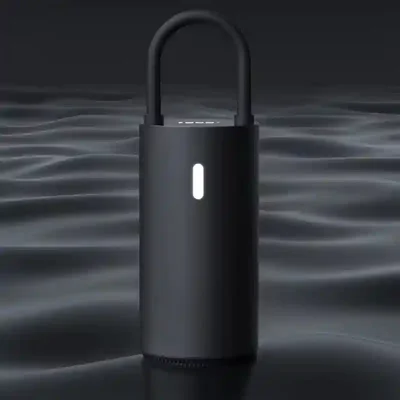 پمپ باد Xiaomi MOJIETU CQB01MC با چراغ روشن در فضای تیره