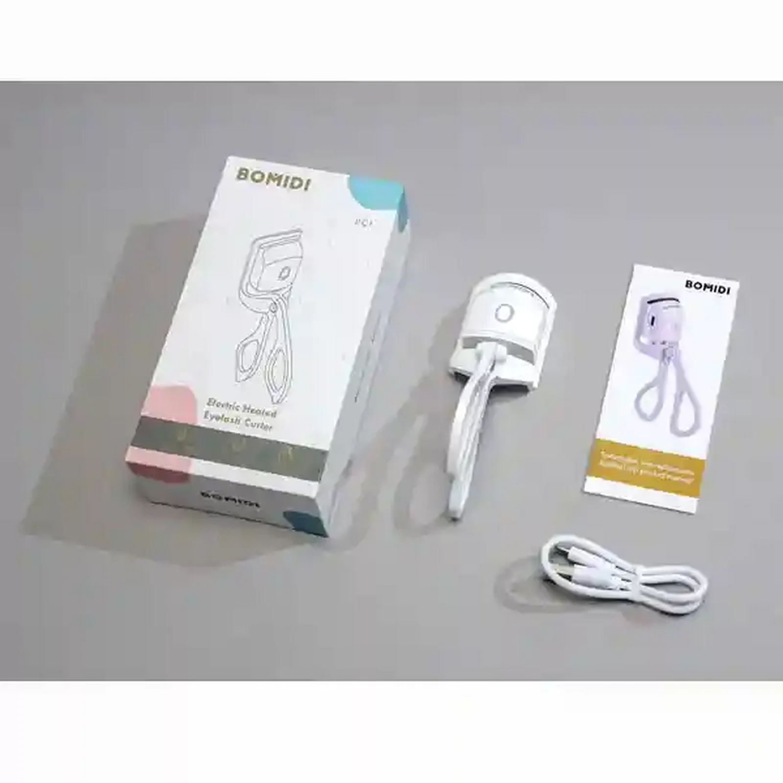 محتویات جعبه فر مژه شارژی Bomidi EC1 با کابل و دفترچه