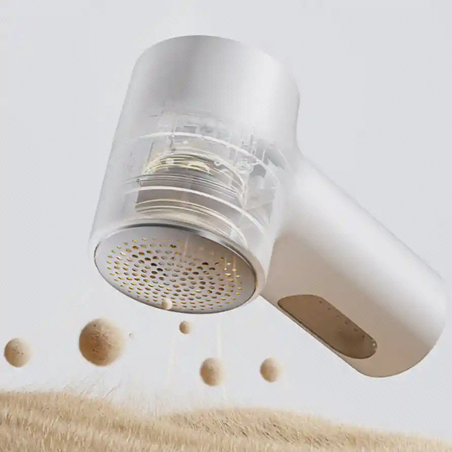 نمای داخلی پرزگیر Mijia Lint Remover 2 نمای بریده پرزگیر سفید Mijia Lint Remover 2 با اجزای داخلی شفاف و سری گرد مشبک بالای پارچه