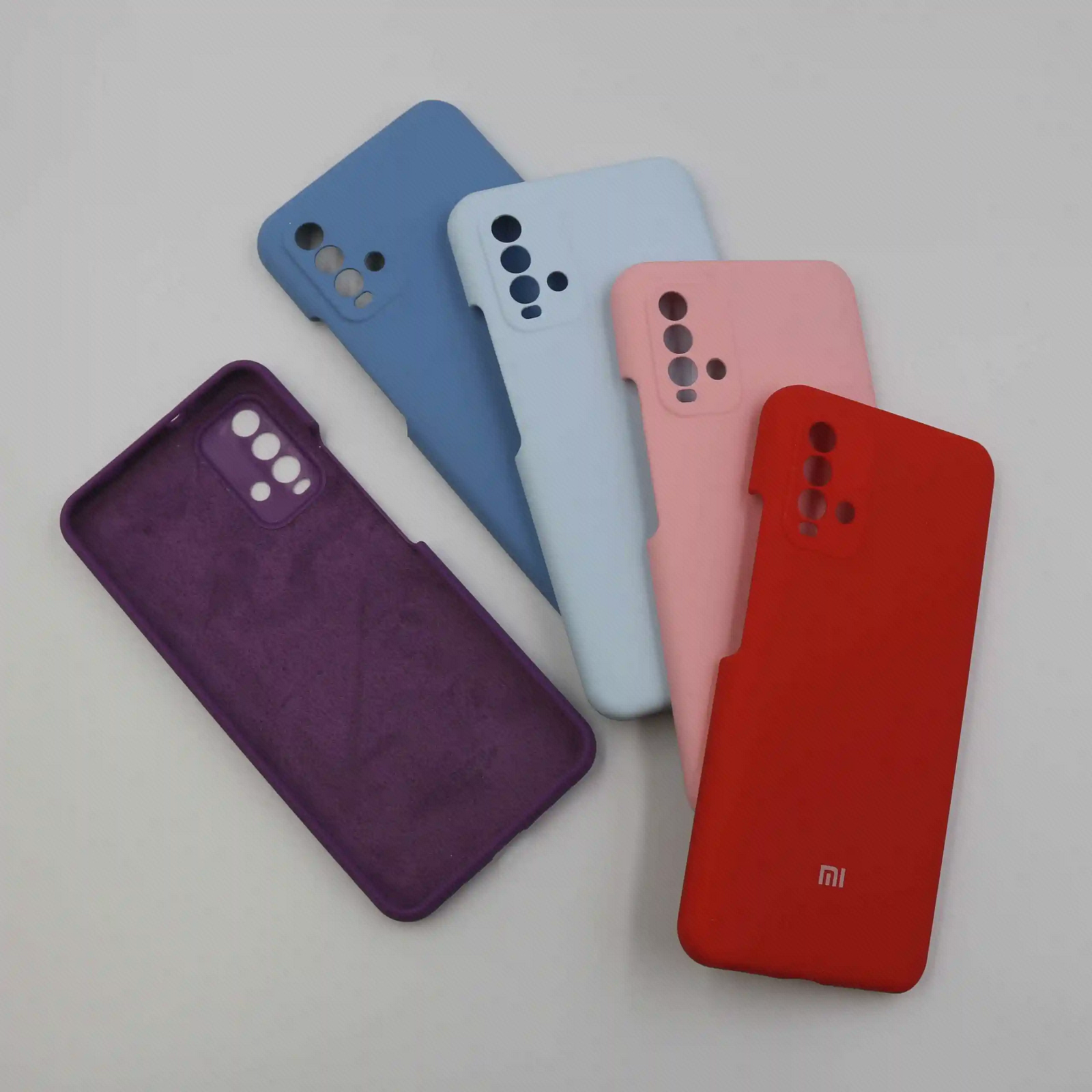 قاب‌های رنگی Redmi 9T کنار هم با نمایش داخل قاب بنفش