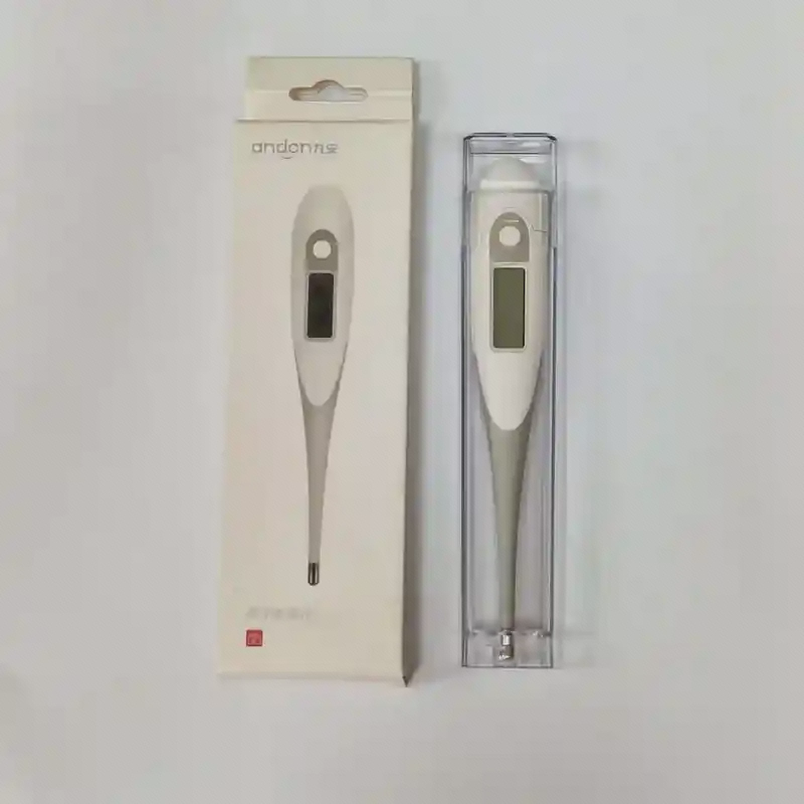تب‌سنج دیجیتال Andon DT-111B داخل محفظه شفاف کنار جعبه