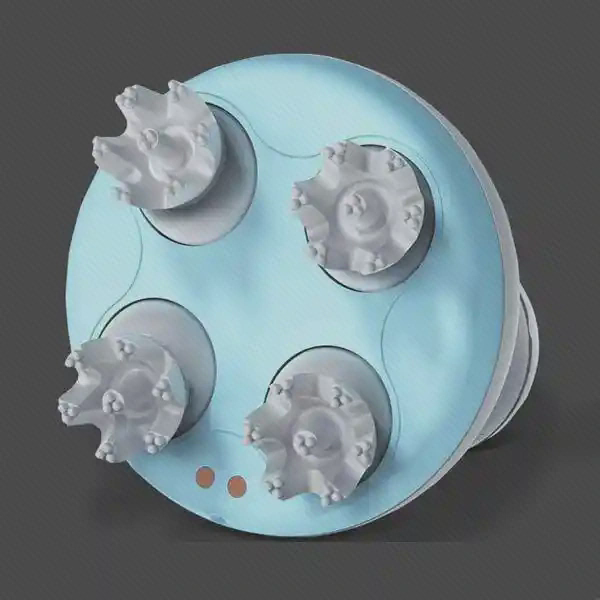 نمای زیر ماساژور Mini M2 با چهار سر برجسته روی صفحه آبی روشن و دو نقطه اتصال